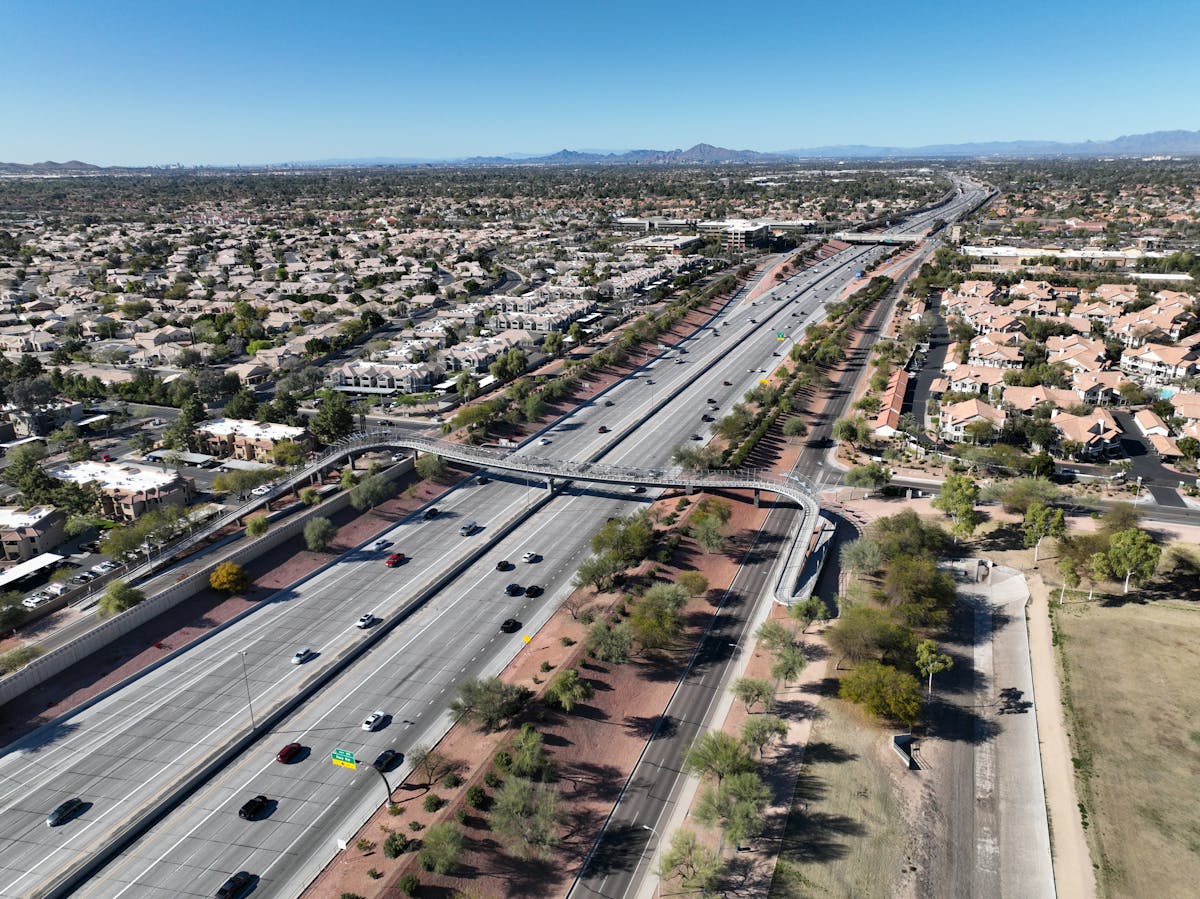 Aerial shot of Chandler, Arizona showcasing highways and residential areas under clear skies.
