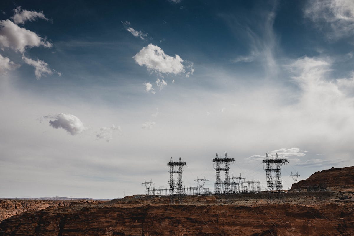 High-voltage power lines stretch across the desert landscape at North Rim, Arizona